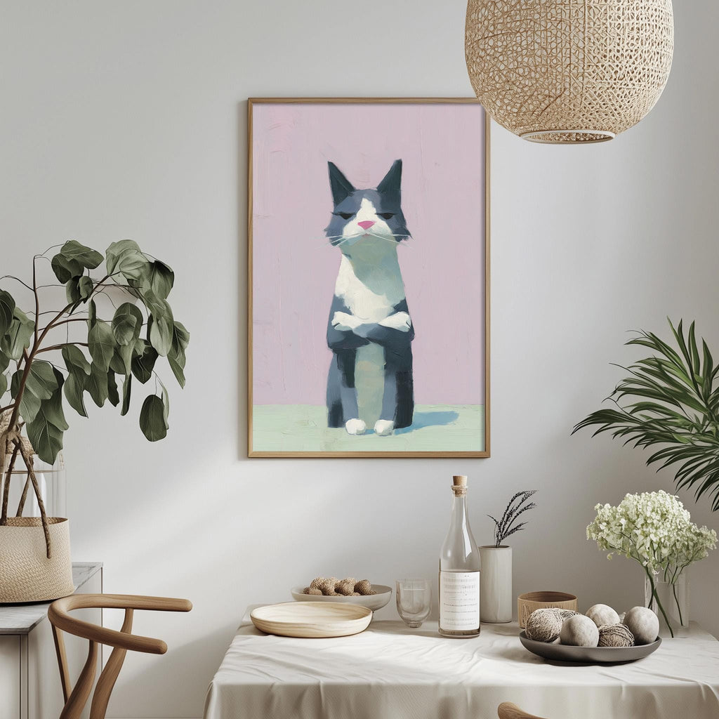a framed painting of a cat sitting on a pink background, hanging on a wall above a dining table with various decorative items and plants.