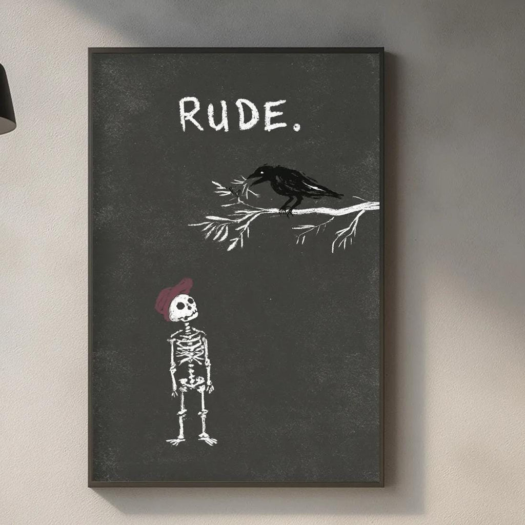 a kitchen counter with various items such as a cutting board, a bottle, and a plant. Above the counter, there is a framed artwork depicting a skeleton wearing a red hat and a bird, with the word "Rude" written on the artwork.
