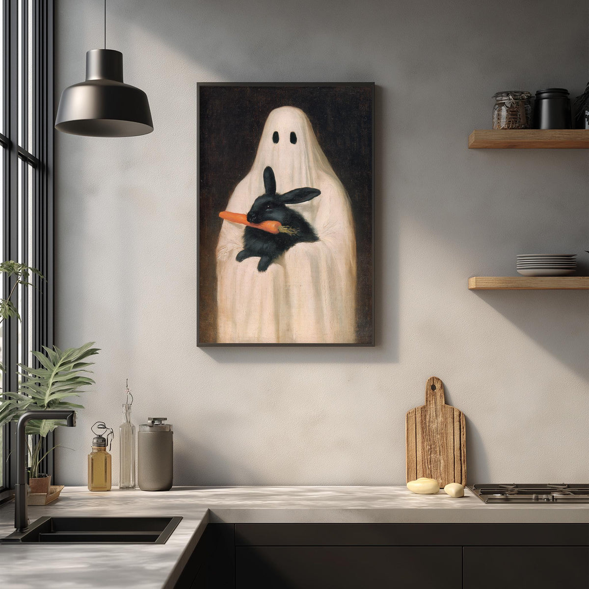 a kitchen counter with various items, including a potted plant, a bottle, a vase, and a wooden cutting board. Above the counter, there is a framed painting of a ghost holding a black rabbit.