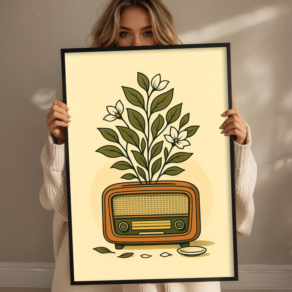 A woman holds up a framed illustration of a radio with a plant growing out of it.