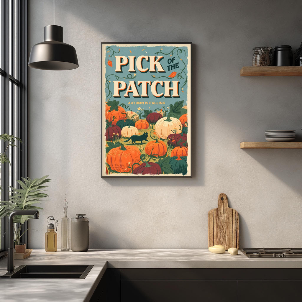 a framed poster of pumpkins hanging on a wall above a kitchen counter.