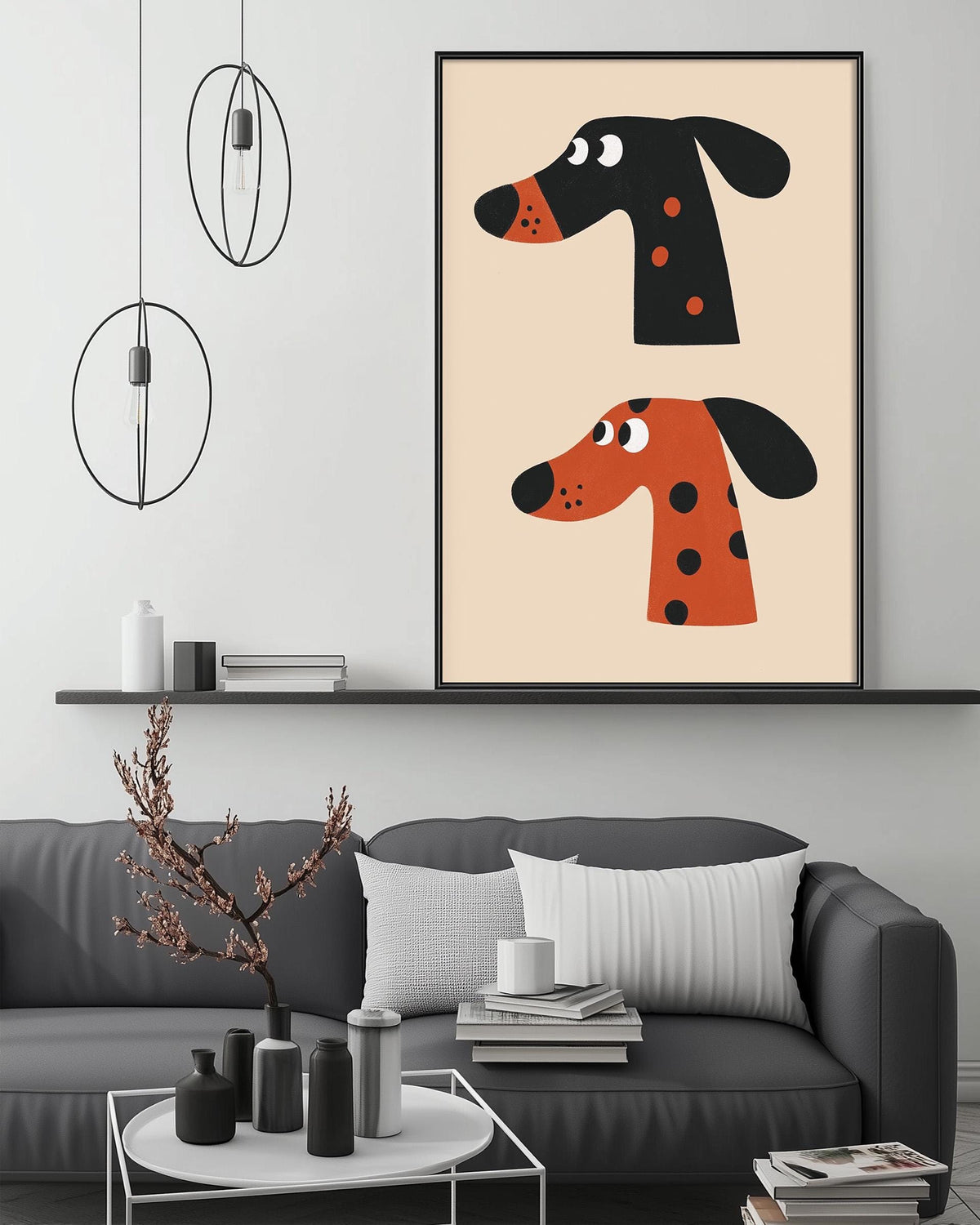 a modern living room with a gray sofa, a coffee table, and a large framed poster of two cartoon dog heads on the wall above the sofa.