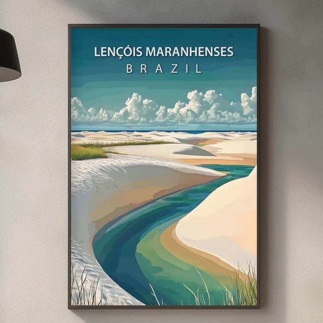 a framed poster of a beach scene with a river, hanging on a wall above a kitchen counter with various kitchen items and a wooden cutting board.