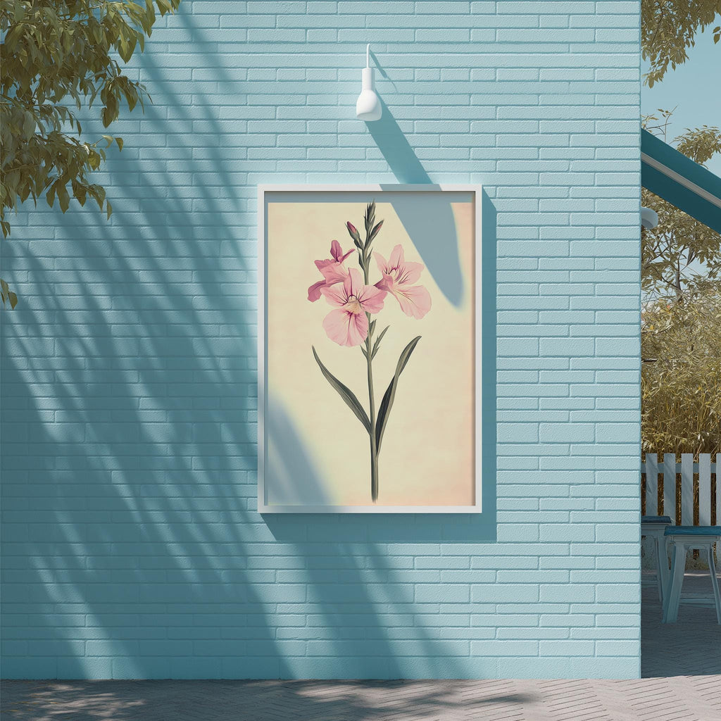 a blue brick wall with a framed picture of a pink flower hanging on it.
