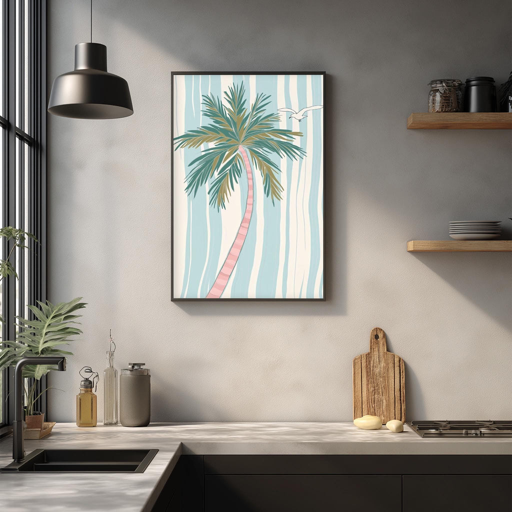 a kitchen counter with a framed picture of a palm tree, a wooden cutting board, and various kitchen items such as a bottle, a vase, and a bowl.