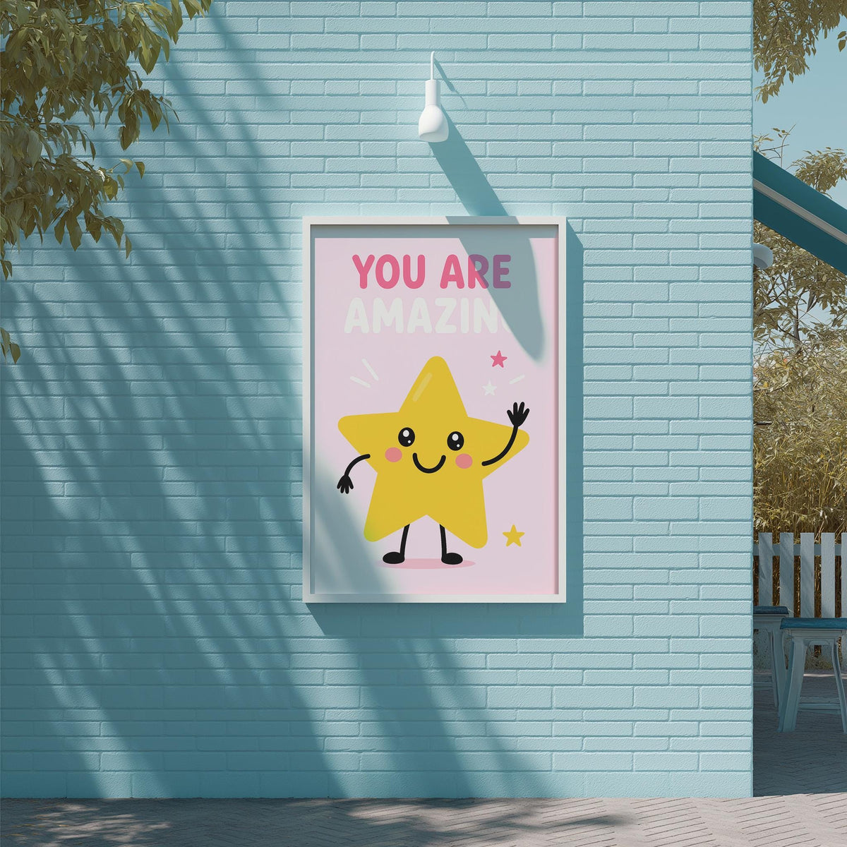 A framed poster with a cheerful yellow star character on a blue wall, displaying the text "YOU ARE AMAZIN" and a smiling face.