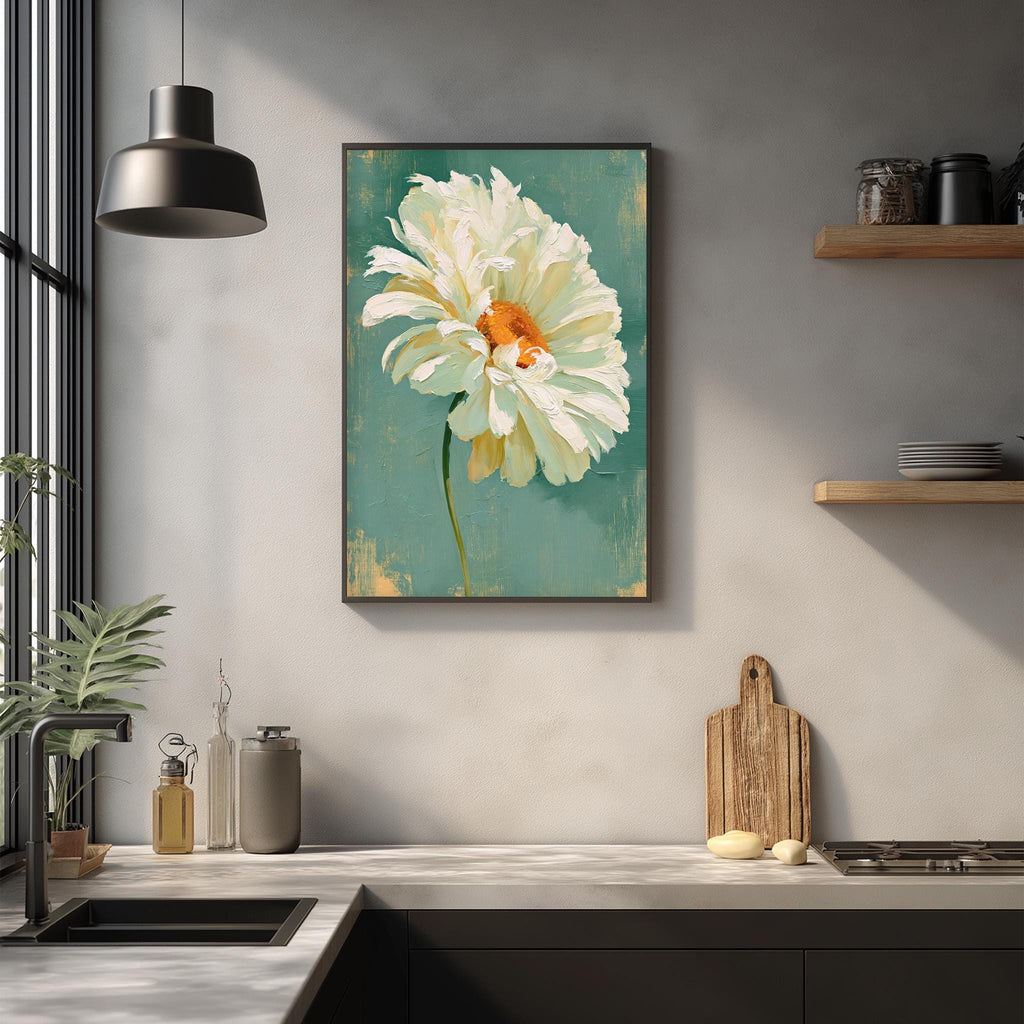 a kitchen counter with a framed painting of a large white flower hanging above it. The painting is set against a green background, creating a vibrant and lively atmosphere in the kitchen.