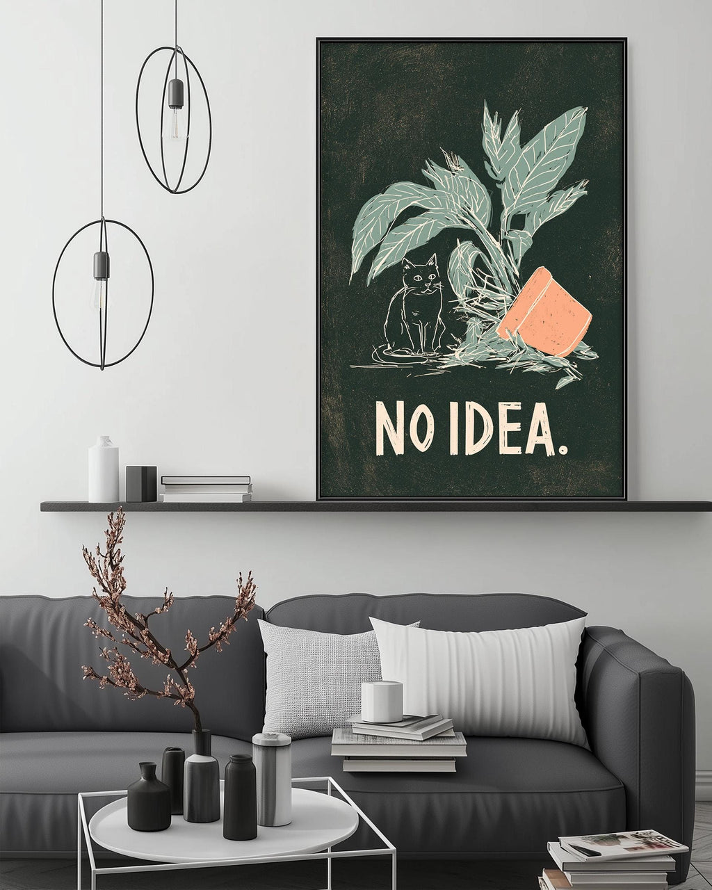 a living room with a gray couch, a coffee table, and a large framed poster with a cat and the text "NO IDEA."