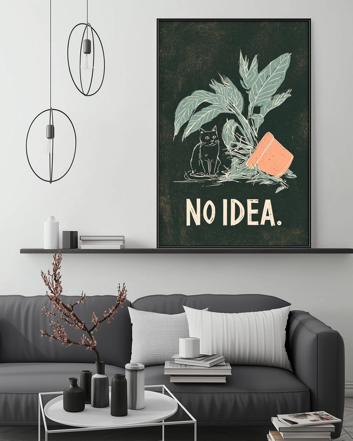 a living room with a gray couch, a coffee table, and a large framed poster with a cat and the text "NO IDEA."