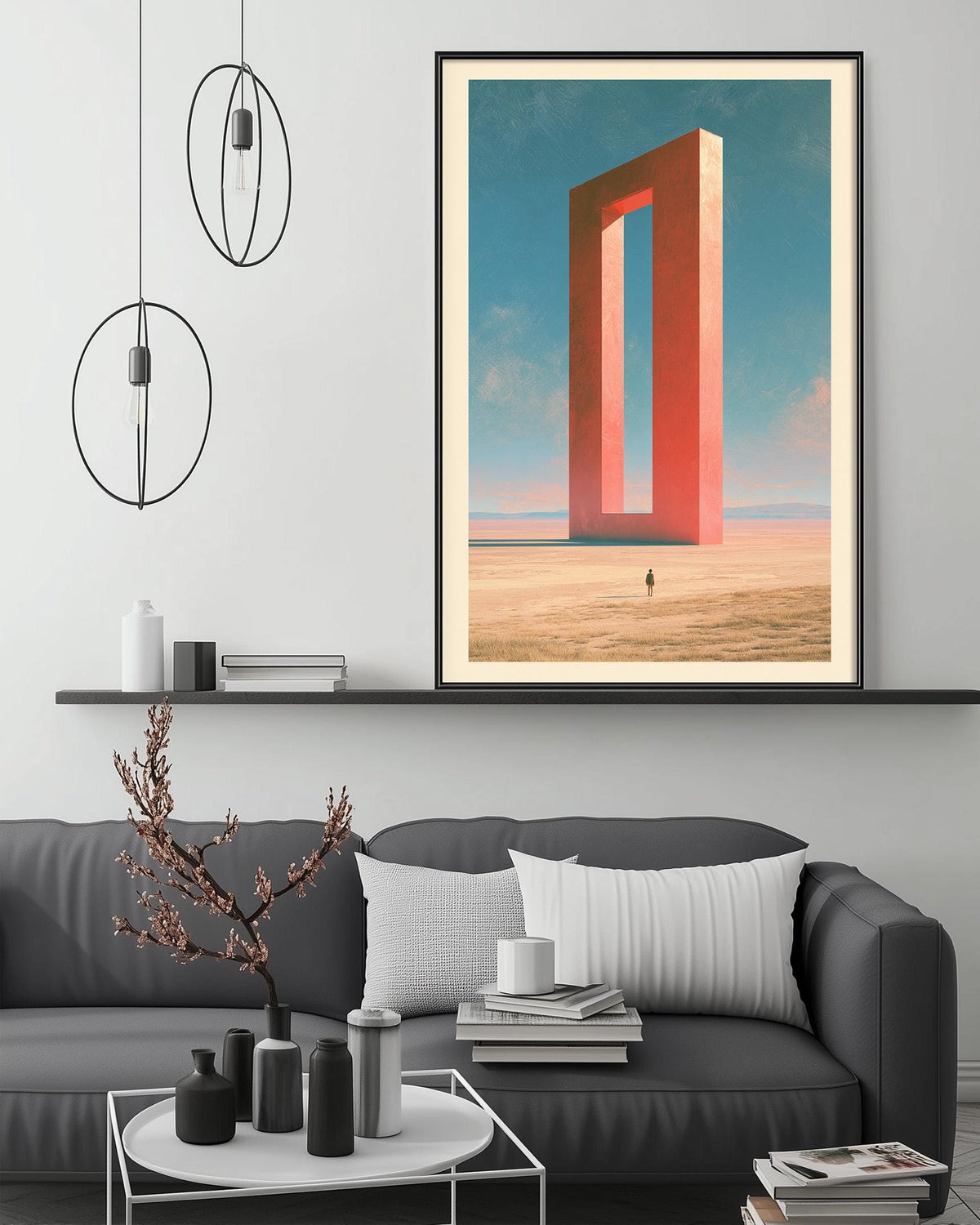 a modern living room with a gray sofa, a coffee table, and a large framed artwork depicting a surreal landscape with a tall, red structure in the background.