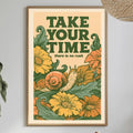 a framed poster with a vibrant illustration of flowers and a snail, hanging on a wall above a dining table with various items on it.