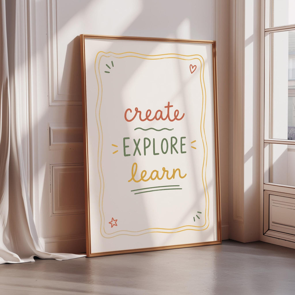 A framed poster with the text "CREATE EXPLORE LEARN" is displayed on a wall, with a window and curtain visible in the background.