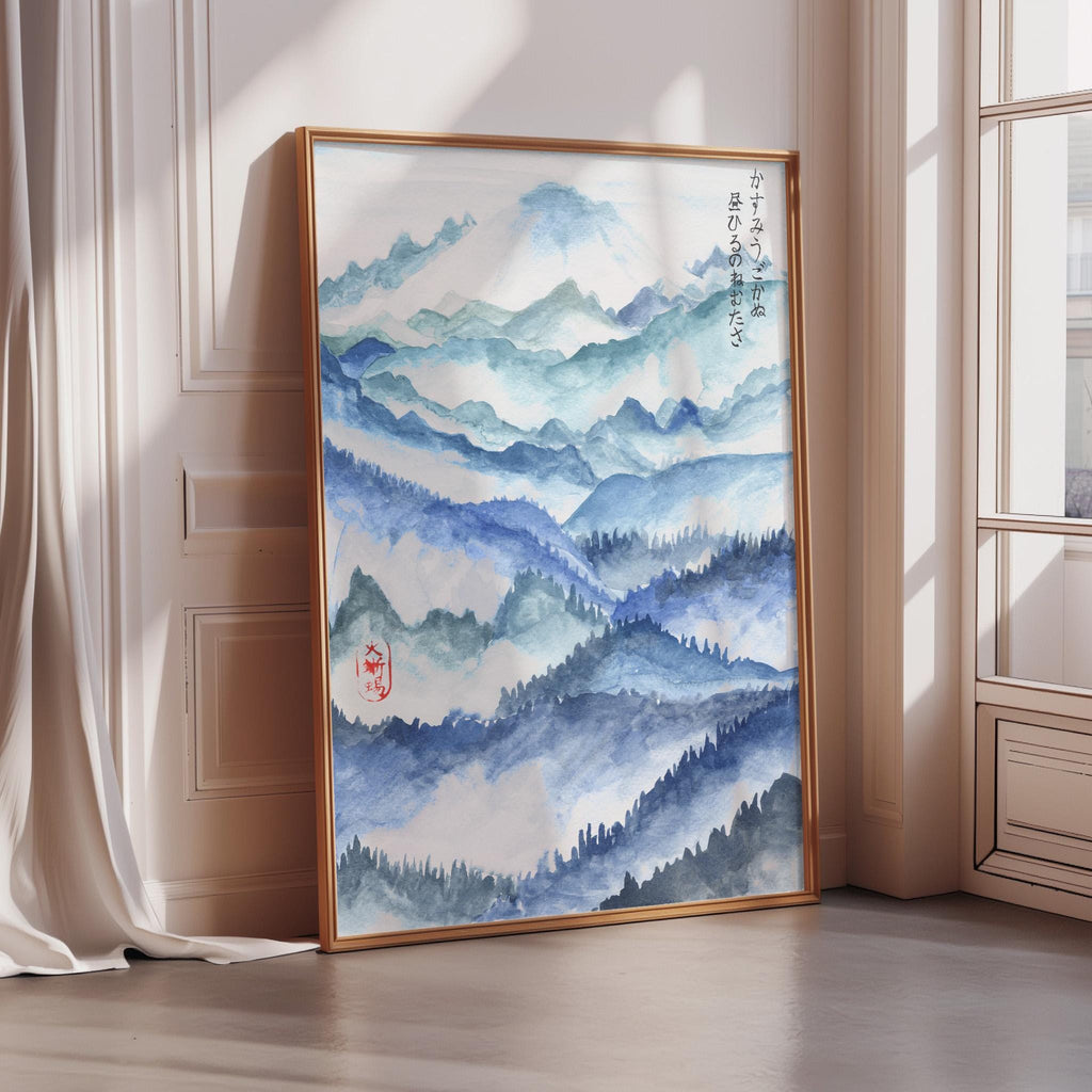 a large framed painting of a mountainous landscape with a blue and white color scheme.