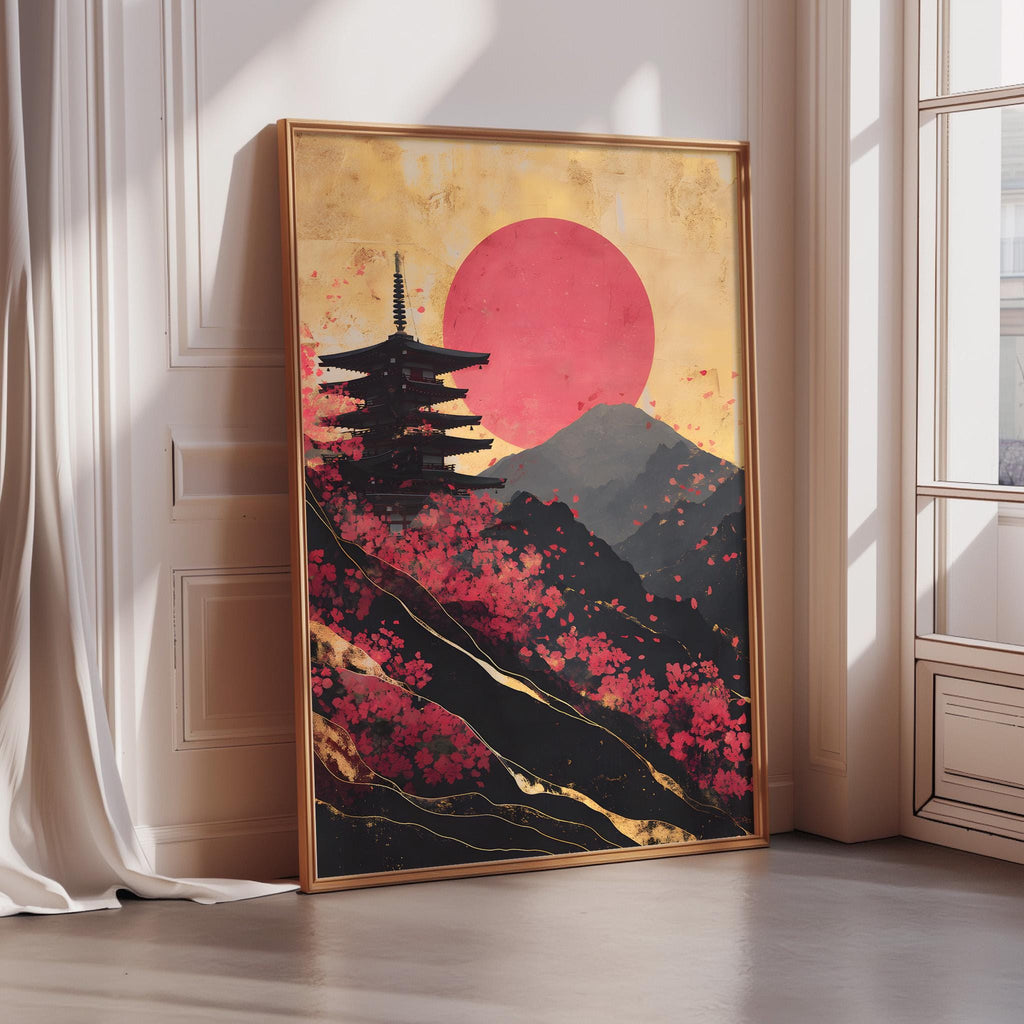 A framed painting depicting a pagoda silhouetted against a vibrant sunset landscape with mountains and pink flowers.