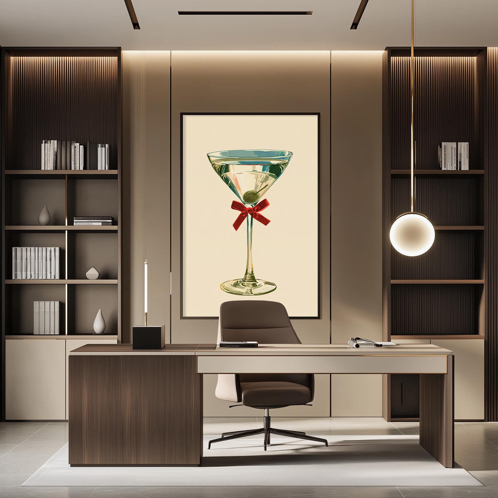 a modern office space with a large framed picture of a martini glass on the wall, featuring a red ribbon around it. The office has a wooden desk, a chair, and a bookshelf filled with books.