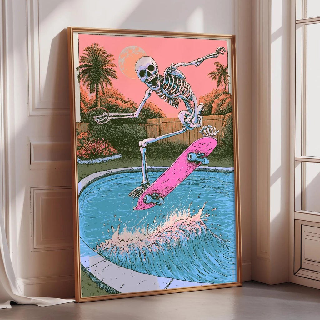 A framed illustration of a skeleton skateboarding on a pink skateboard, with a pool and palm trees in the background.