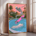 A framed illustration of a skeleton skateboarding on a pink skateboard, with a pool and palm trees in the background.