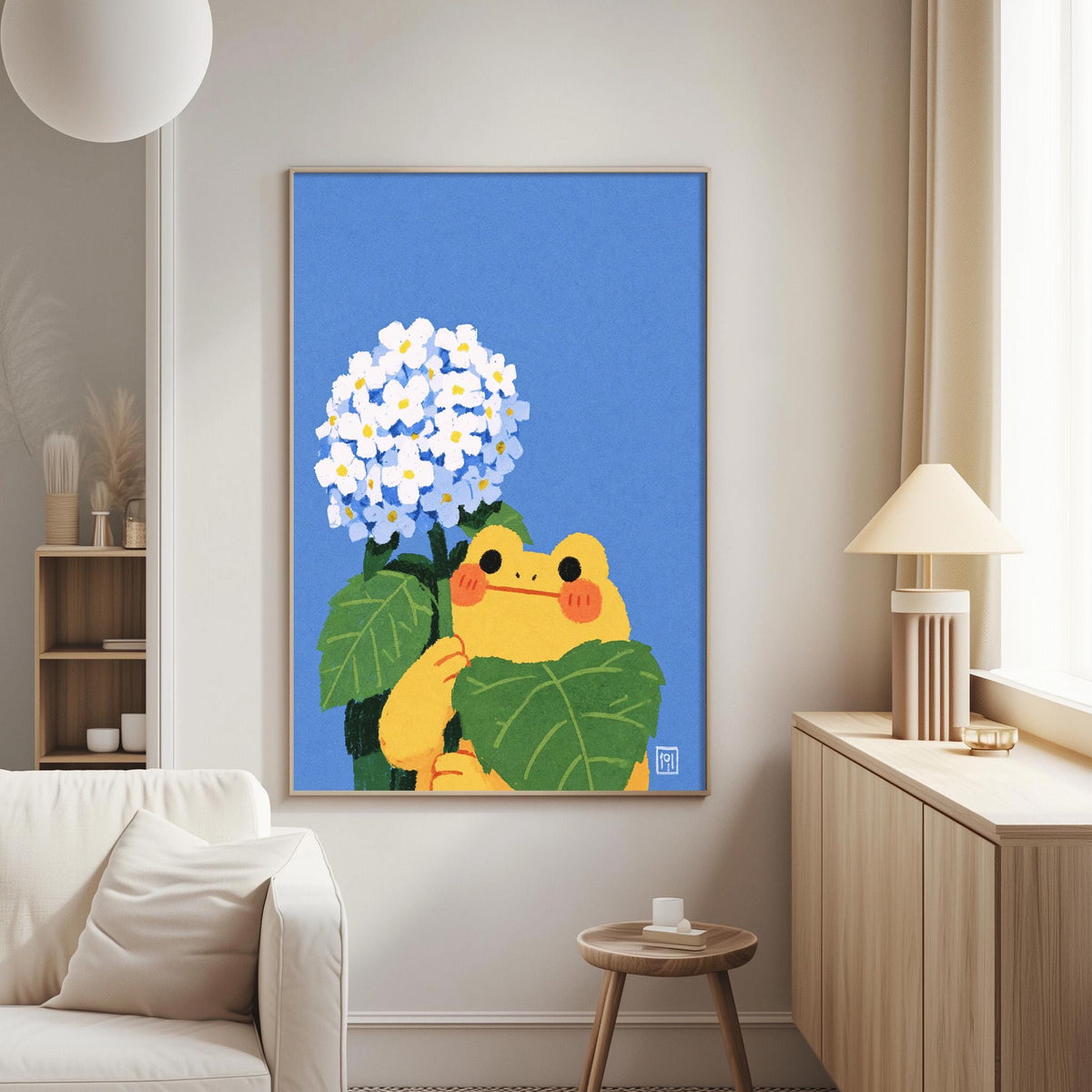 a cozy living room with a large framed illustration of a frog holding a bunch of blue flowers on a wall.