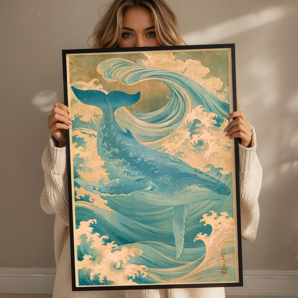 A woman holds up a framed painting of a blue whale in the ocean, surrounded by waves and clouds.