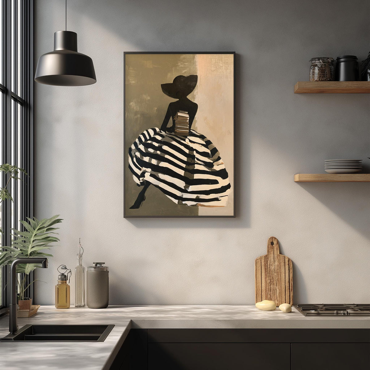 a kitchen counter with a framed artwork of a woman in a striped dress hanging on the wall above it. The kitchen counter also has various items such as a cutting board, a bottle, and a vase.