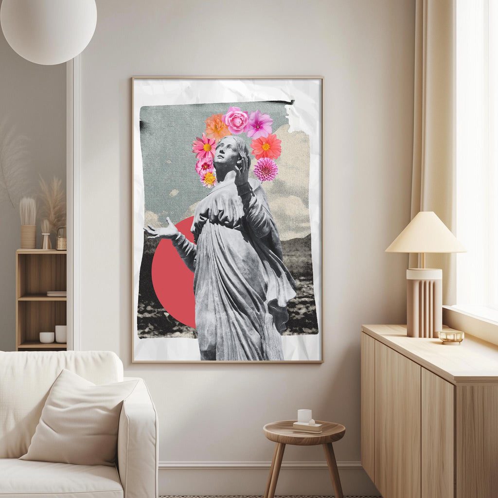a large framed artwork depicting a woman with a floral headpiece, standing in a minimalist setting with a white couch and a wooden side table.
