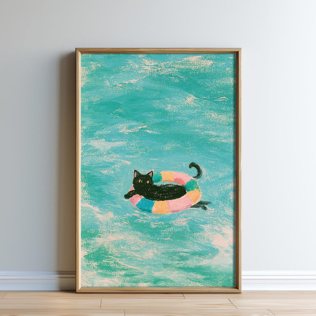 A framed painting depicting a black cat swimming in a colorful inner tube in a turquoise ocean.