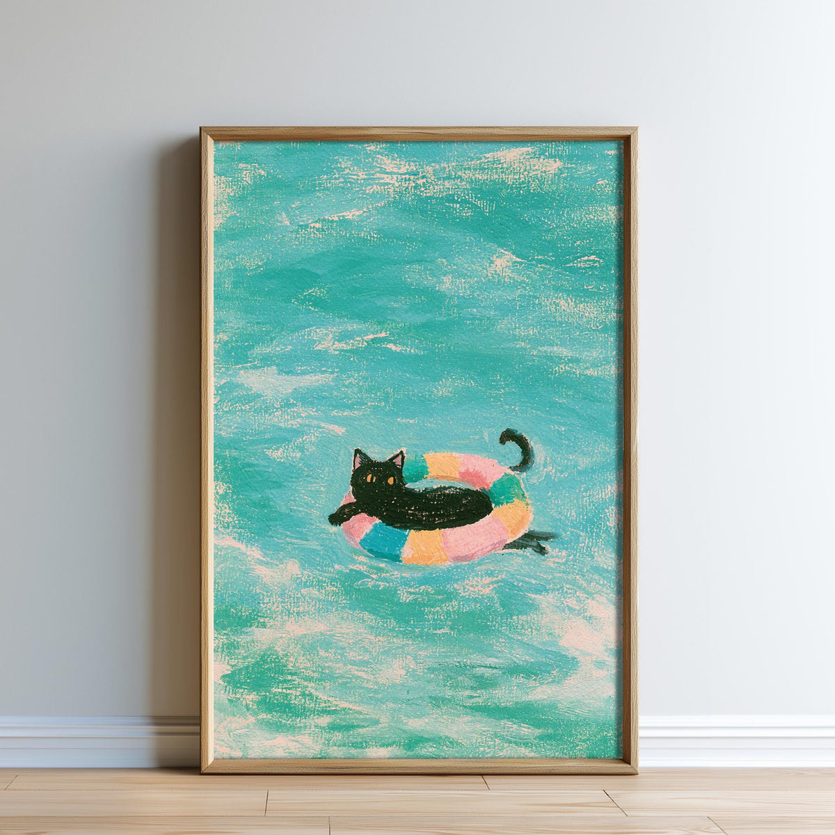 A framed painting depicting a black cat swimming in a colorful inner tube in a turquoise ocean.