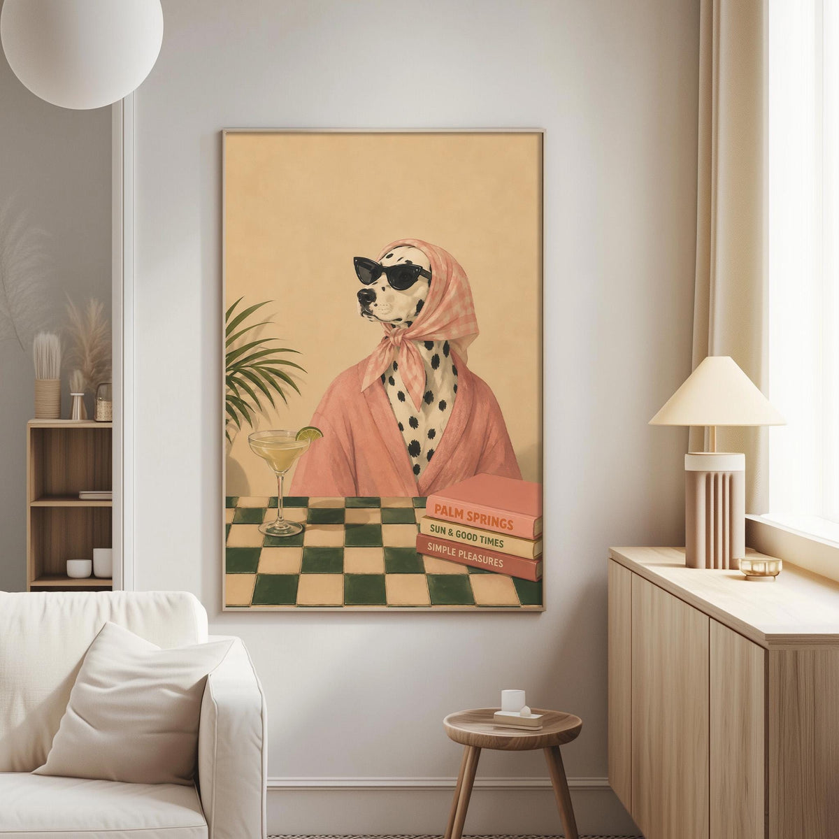 a Dalmatian dog wearing a pink robe and sunglasses, sitting at a table with a drink in a glass.