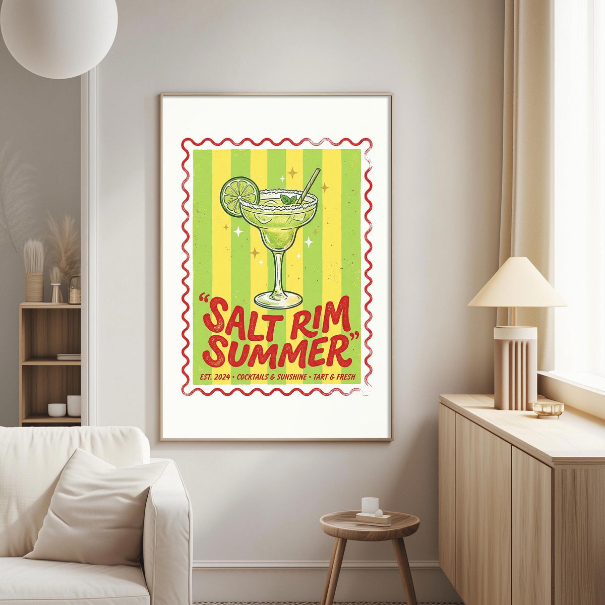 a framed poster of a cocktail glass with a lime on a wall in a living room.