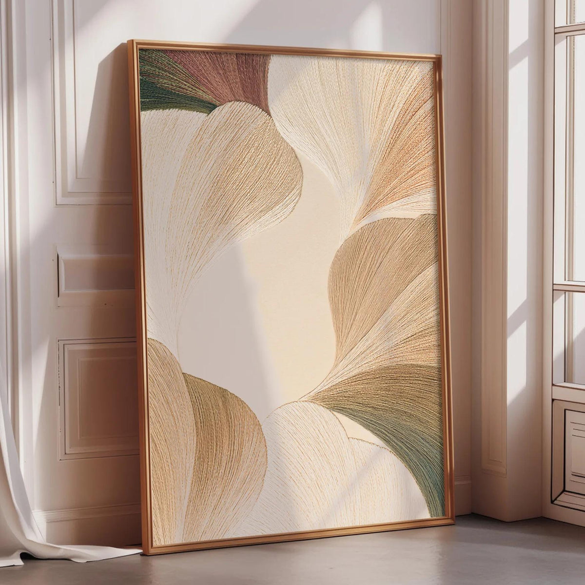 a large framed artwork with a floral design, placed on a wooden floor in a room with a window.