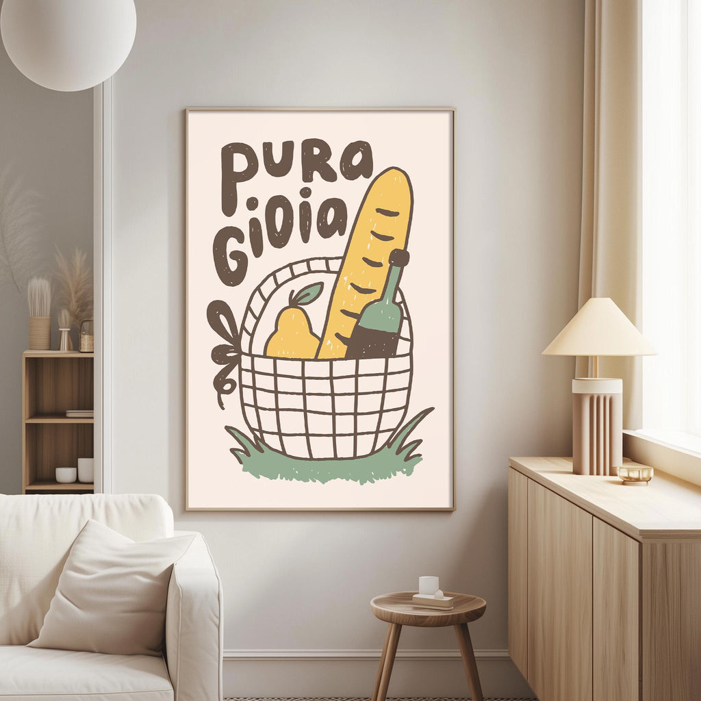 a living room with a white couch, a wooden side table, and a framed poster on the wall. The poster has a basket with various food items, including a loaf of bread, a bottle, and a pear, along with the text "PURA GIOLIA".