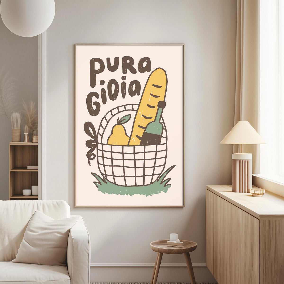 a living room with a white couch, a wooden side table, and a framed poster on the wall. The poster has a basket with various food items, including a loaf of bread, a bottle, and a pear, along with the text "PURA GIOLIA".