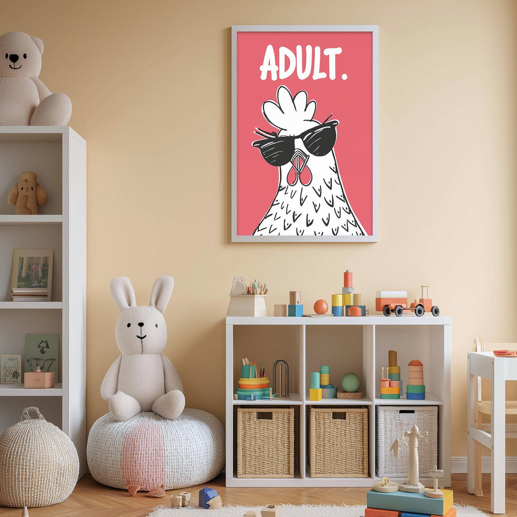 A child's bedroom with a white bookshelf, a stuffed rabbit, and a colorful toy box. Above the bookshelf is a framed poster with a cartoon chicken wearing sunglasses and the word "adult."