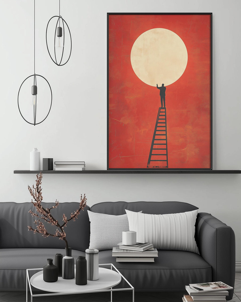 a modern living room with a gray sofa, a coffee table, and a large framed artwork depicting a person standing on a ladder reaching for a large orange circle in the sky.