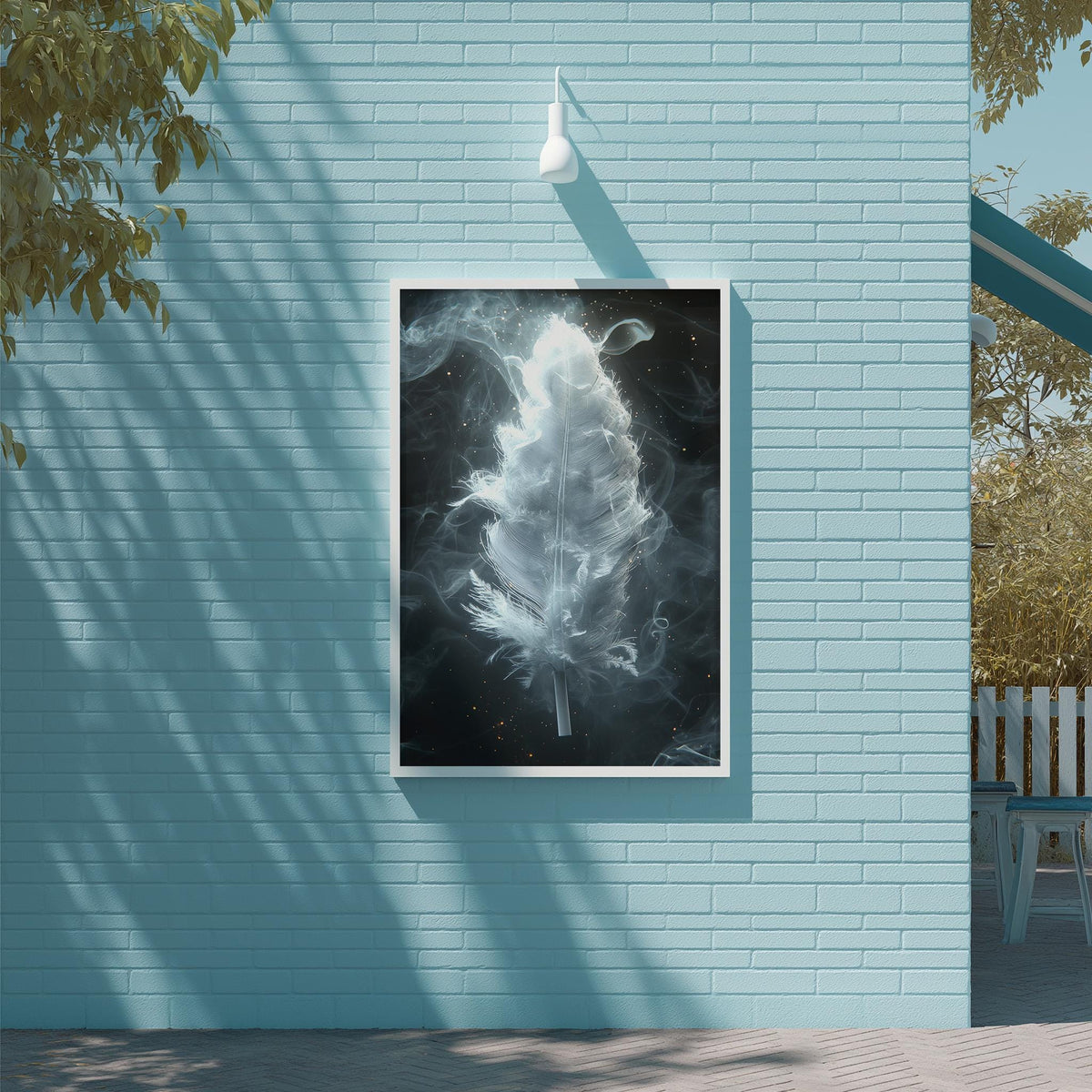 a large, framed artwork of a feather suspended on a light blue brick wall.