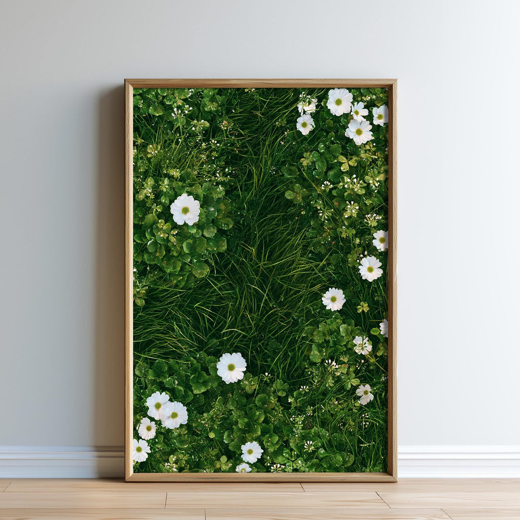 A framed image of a lush green grassy area with white flowers, creating a serene and natural scene.