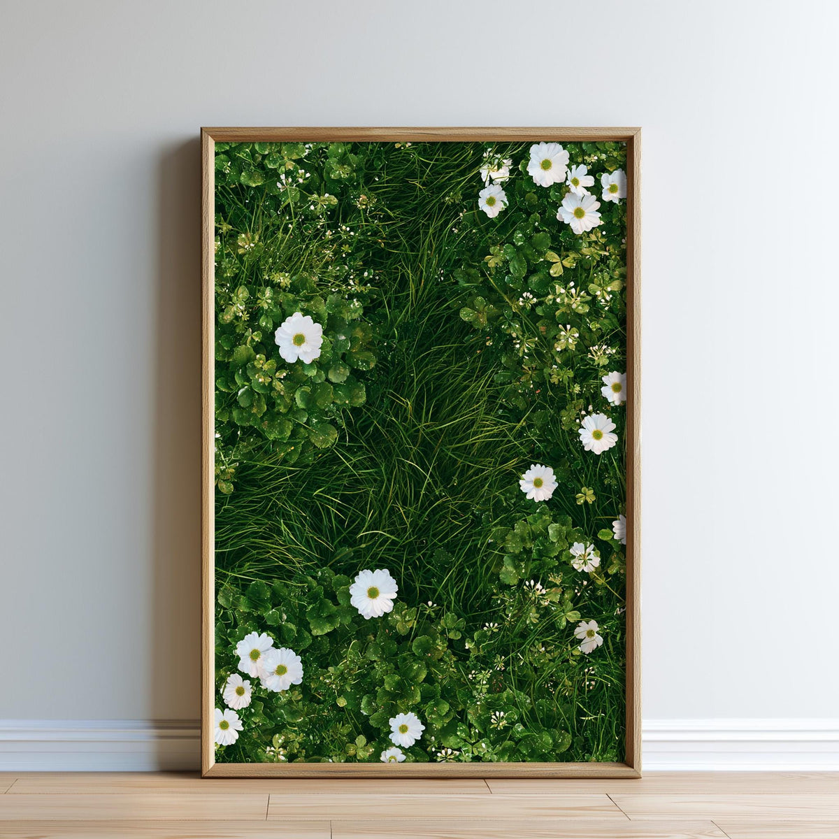 A framed image of a lush green grassy area with white flowers, creating a serene and natural scene.