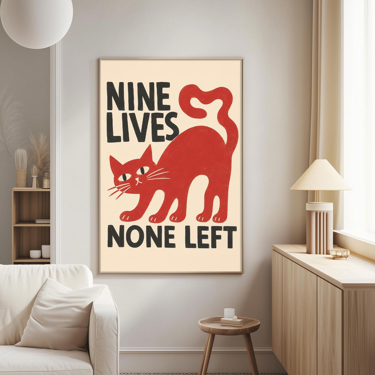 a poster with a red cat and the text "NINE LIVES NONE LEFT" on a wall in a living room setting.