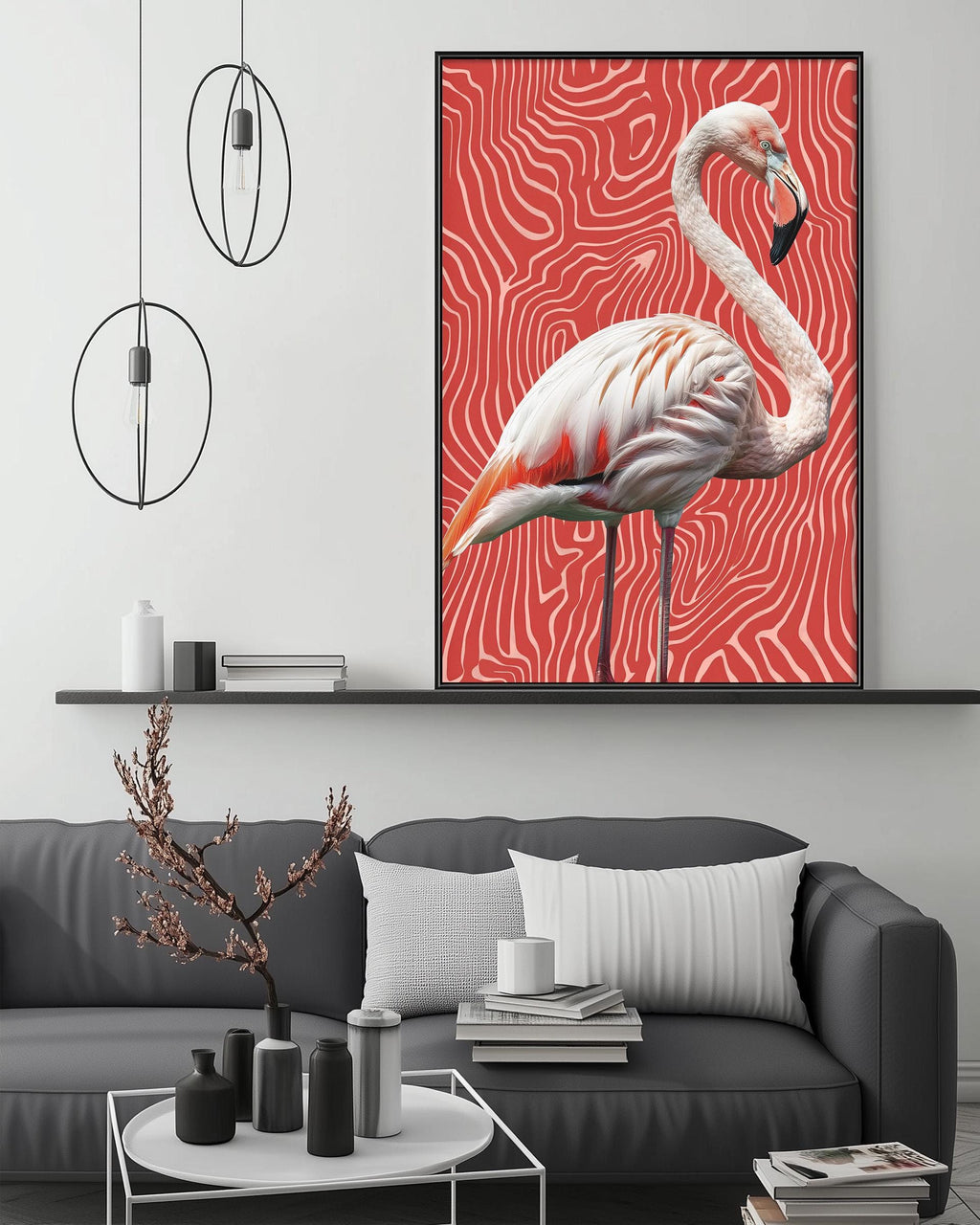 a large framed painting of a flamingo on a red and white striped background, hanging above a gray couch in a modern living room setting.