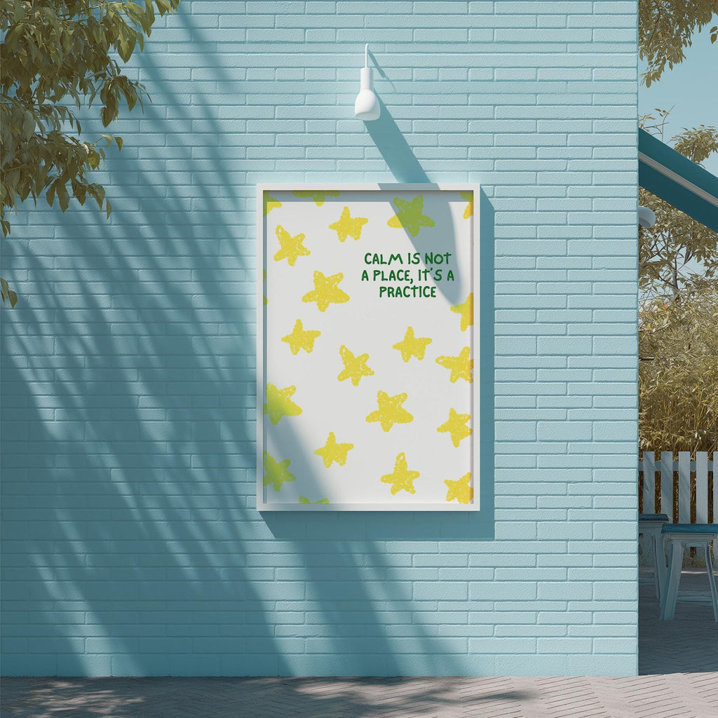 a poster with a yellow star pattern on a blue wall, accompanied by the text "Calm is not a place, it's a practice" in green.