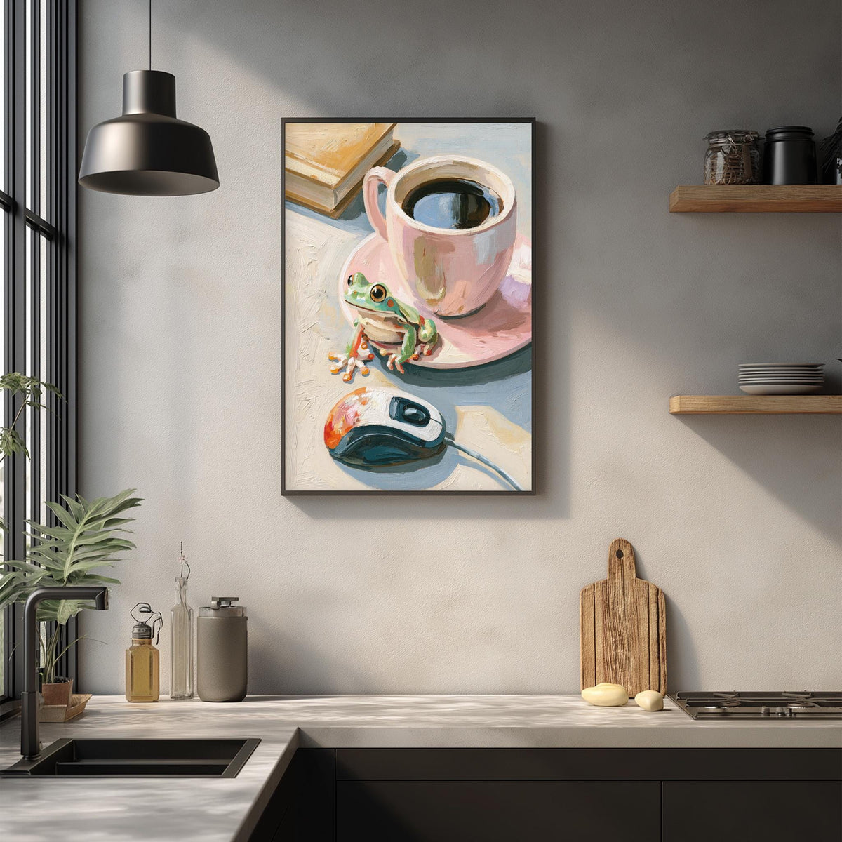 a kitchen counter with a framed painting of a frog sitting on a coffee cup, a computer mouse, and a wooden cutting board.