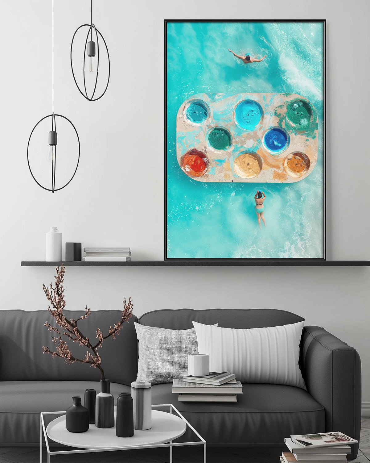 a modern living room with a gray sofa, a coffee table, and a large framed artwork depicting a person swimming in a pool with colorful floaties.