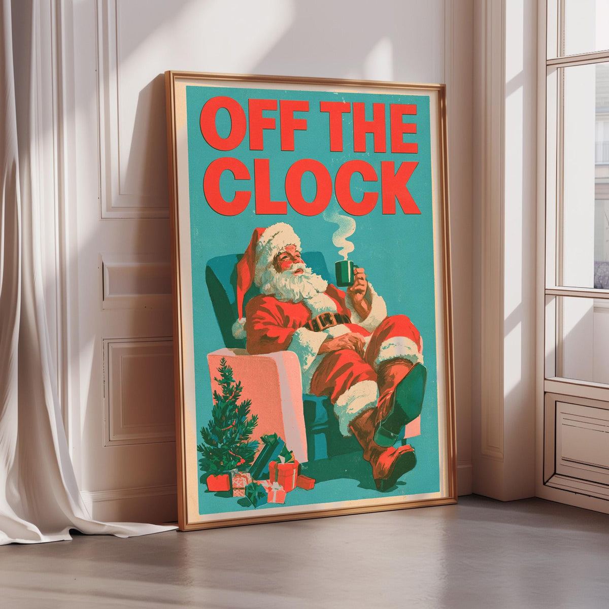 A framed poster of Santa Claus sitting in a chair, holding a cup of coffee, with the text "OFF THE CLOCK" prominently displayed.