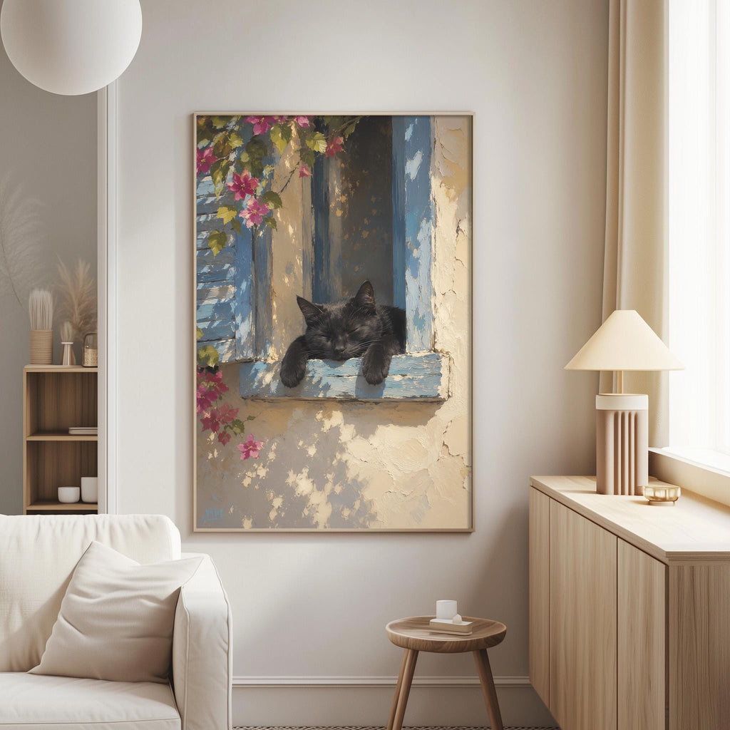 a cozy living room with a large painting of a black cat resting on a window sill, surrounded by pink flowers. The painting is hung on the wall above a white sofa, and a wooden side table is located next to the sofa.