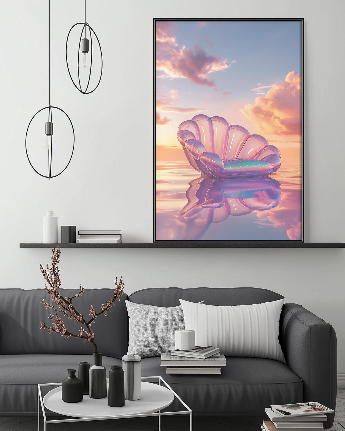 a large, colorful painting of a shell floating on a calm body of water, with a stunning sunset in the background. The painting is displayed on a wall above a gray couch, which has a coffee table in front of it. The room has a minimalist and modern design, with a few decorative items such as a potted plant, vases, and books.