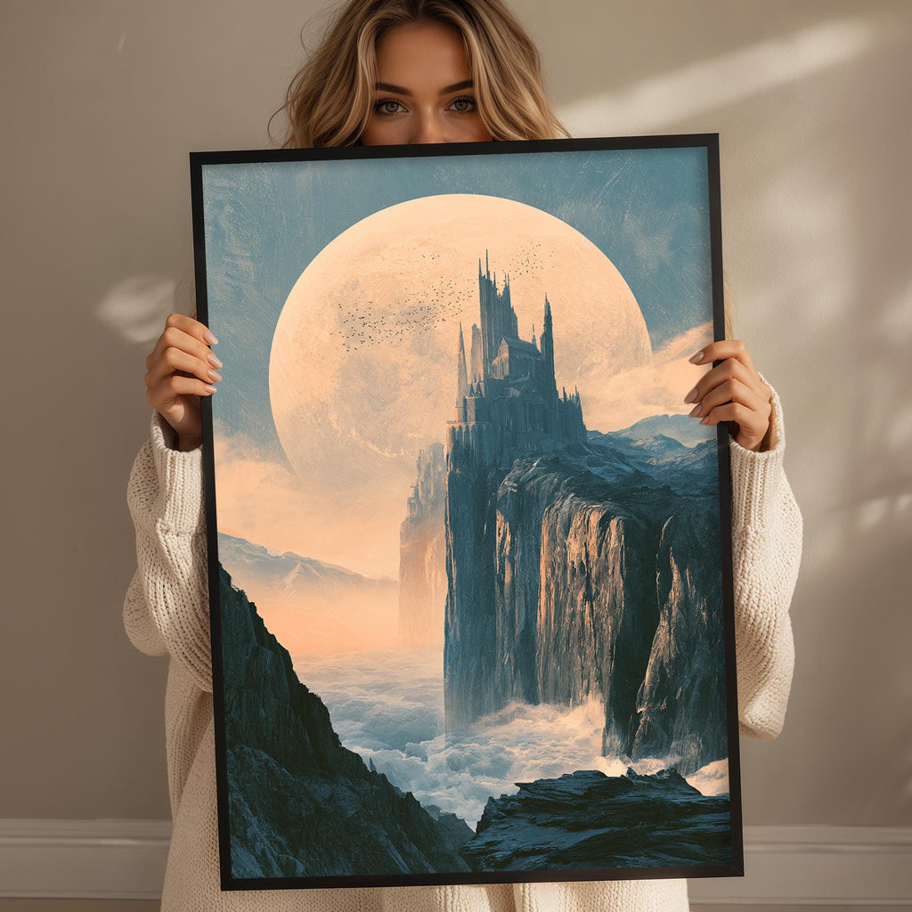 A woman holds up a framed picture depicting a fantastical landscape with a castle-like structure, a large moon, and a misty, mountainous terrain.