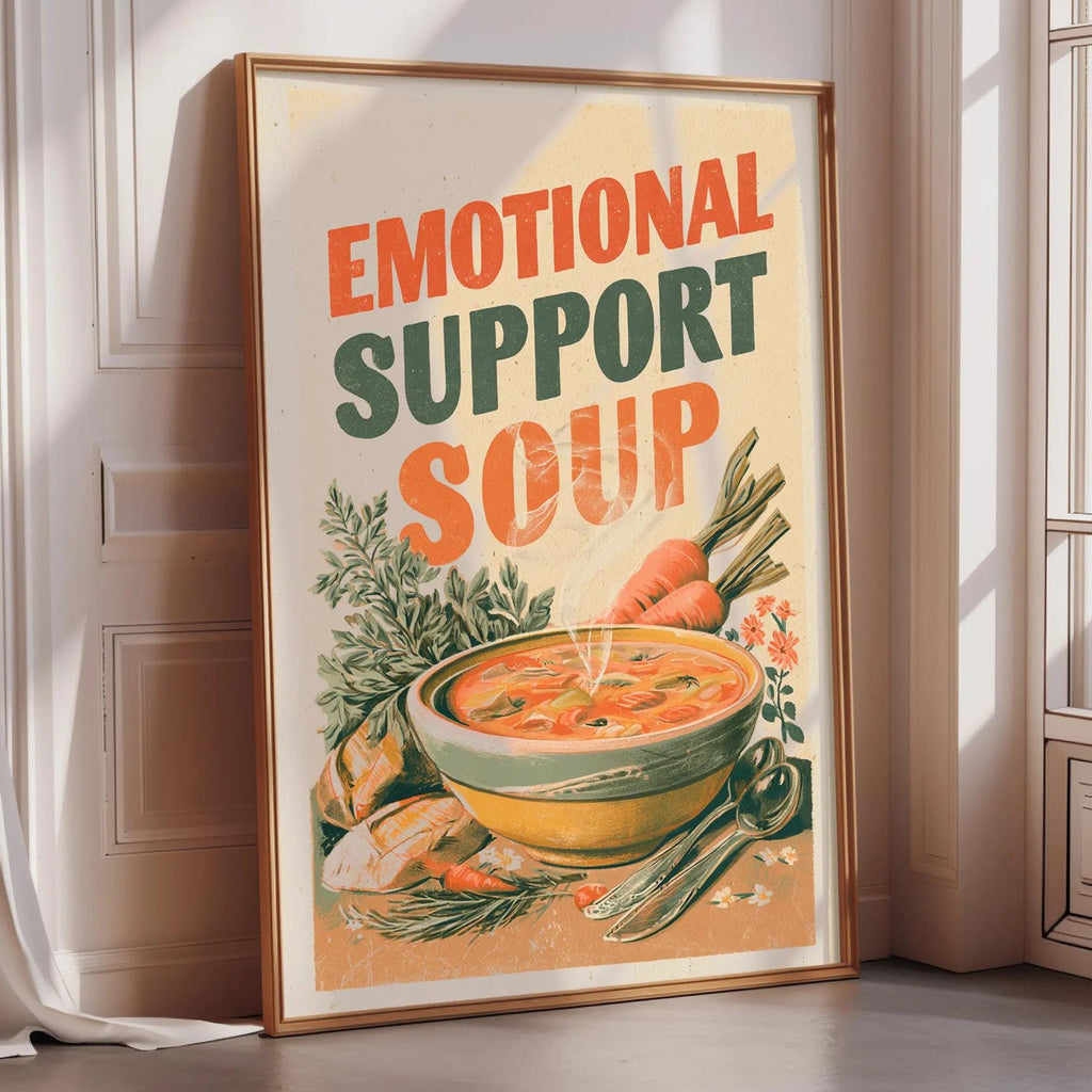 a framed poster with the text "Emotional Support Soup" and an illustration of a bowl of soup surrounded by vegetables.