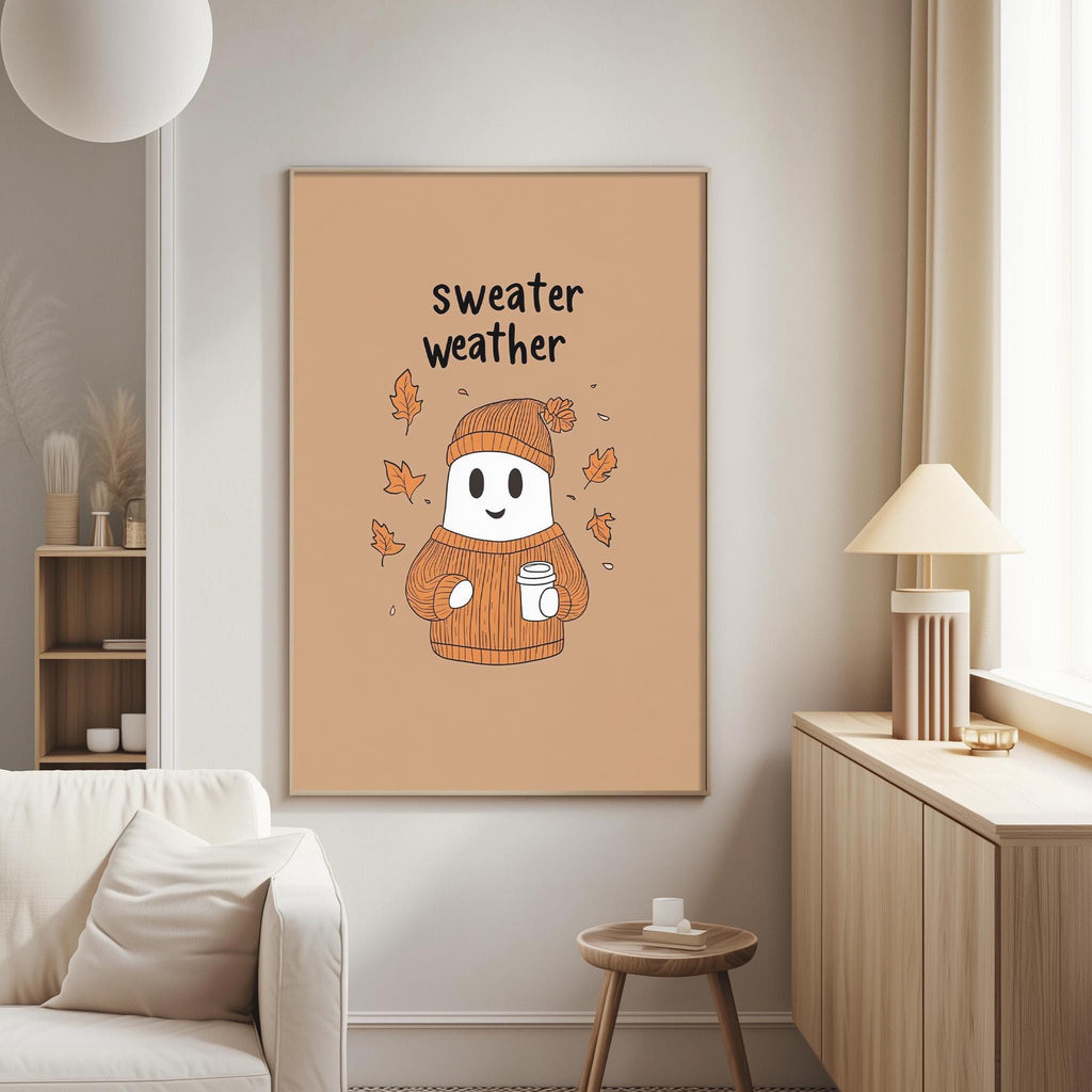a cozy living room with a large framed poster of a ghost wearing a sweater and holding a cup of coffee, surrounded by autumn leaves.