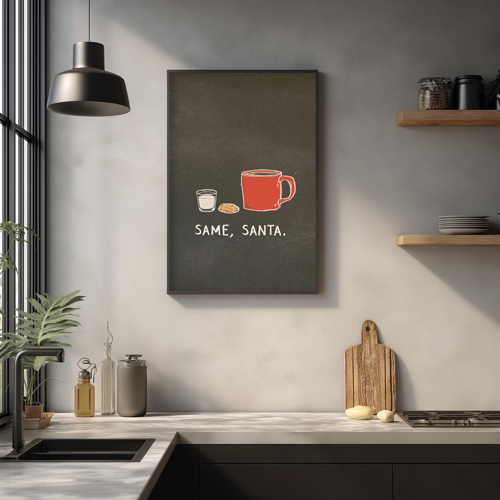 a kitchen counter with various items, including a red mug, a white mug, a small white cup, and a wooden cutting board. Above the counter, there is a framed text that reads "SAME, SANTA."