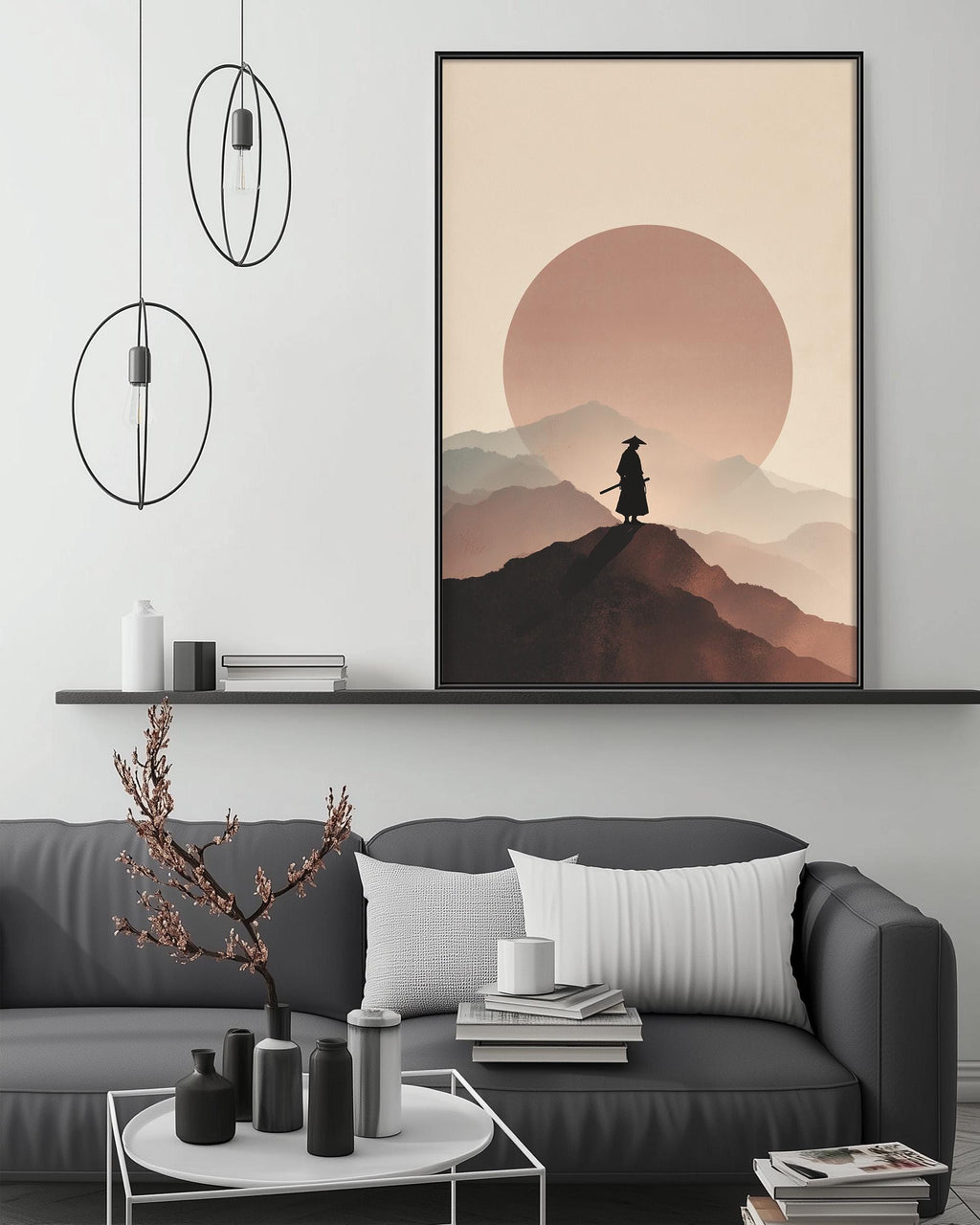 a living room with a gray sofa, a coffee table, and a large framed artwork depicting a person in a cowboy hat standing on a mountain peak with a large sun in the background.